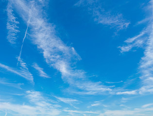 Wall Mural - abstract white clouds and blue sky in sunny day background.natural celestial world concept with blue