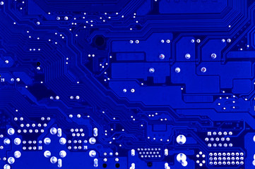 fragment of an electronic computer board in blue