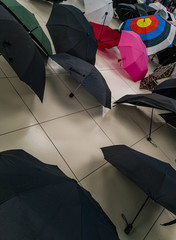  Umbrellas lying on floor in waiting room
