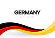 © artyway - The Federal Republic of Germany waving flag banner. German patriotic red, yellow and black ribbon poster. German Unity day anniversary brochure.National public holiday celebration vector illustration