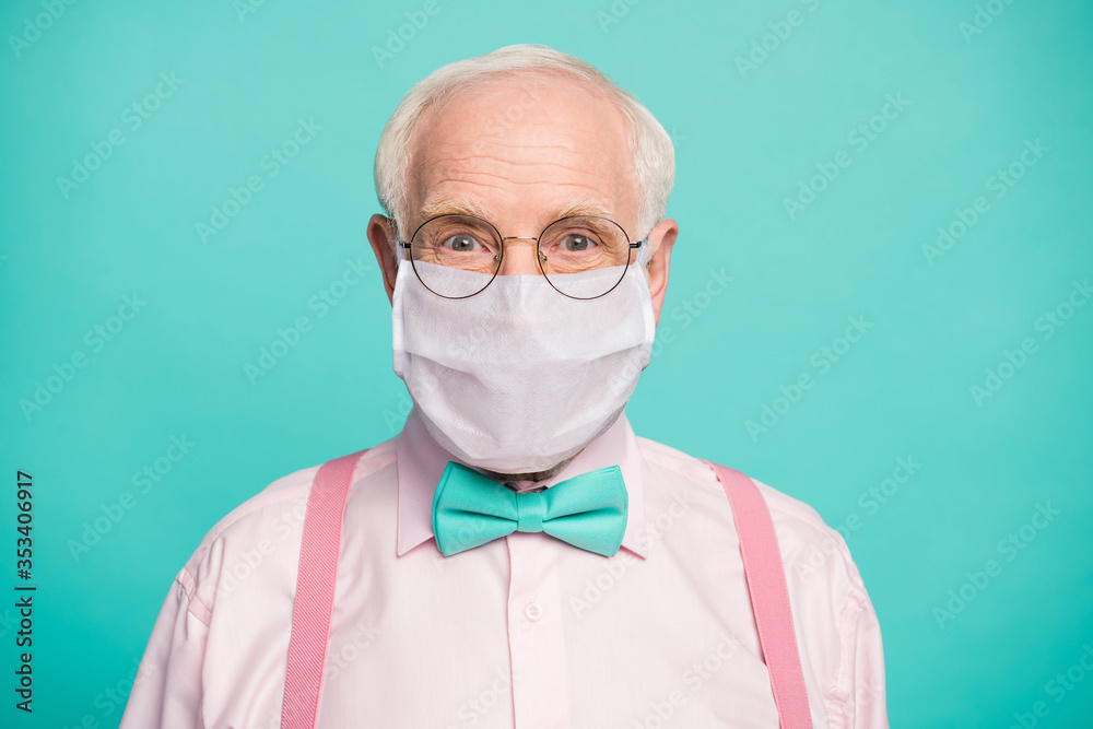 Close-up portrait of his he funky hipster elderly guy wearing gauze mask respiratory influenza flu flue grippe prevention isolated bright vivid shine vibrant teal turquoise blue grren color background - obrazy, fototapety, plakaty 