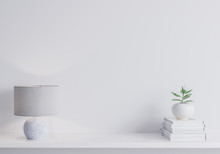 White Modern Wall Mock Up In Modern Interior, Close Up For White Lamp, Books And Green Plant On Shelf, Minimal Design
