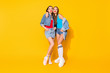 Full size photo of dream charming flirty girls have valentine day celebration want attract cute guy send air kiss wear denim singlet isolated over bright shine color background
