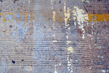 dirty and rough cement street ground with yellow and white stains