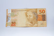 fifty reais banknote (Brazilian currency) on a white background
