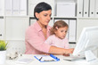 © aletia2011 - Businesswoman with her child working in office