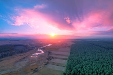 Spring Rural Landscape. The Village In The Evening. Bird's-eye. Panoramic View Of The Village, Fields, Pine Forest, And River During Sunset. Panorama Of 9 Images