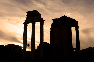 Wall Mural - Roman ruins and backlit columns at sunset in the Roman Forum in Rome Italy