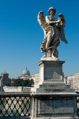 Wall Mural - unique view of the dome of Basilica di San Pietro from Saint angel Castle bridge with a angel statue in front