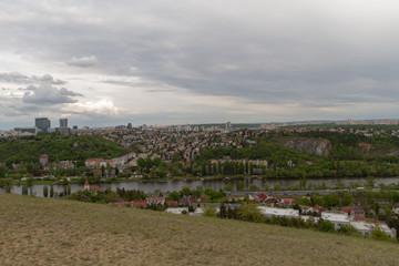 
views of Prague on the roofs of buildings and traffic during the spring day