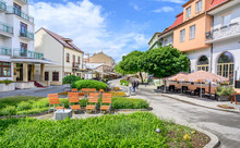Wooden Seats With A Lot Of Green In Pedestrian Zone In Centre Of Spa Town Piestany (SLOVAKIA)