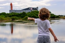 Cape Canaveral, FL, USA - MAY 27, 2020: The Big Dream Of Space. The Child Points A Finger At The Space Center.