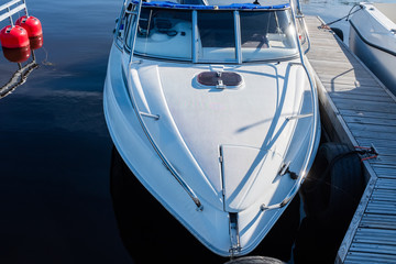 Poster - beautiful white boat stands on a pier in the water