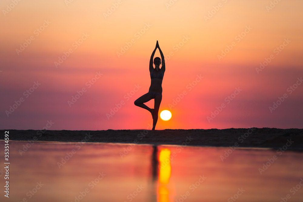 Vrikshasana tree pose from yoga by woman silhouette on sunset Stock ...