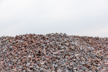 Wall Mural - A pile of stone building materials on the sky background