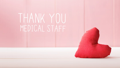 Sticker - Thank You Medical Staff message with a red heart cushion over a pink wooden wall