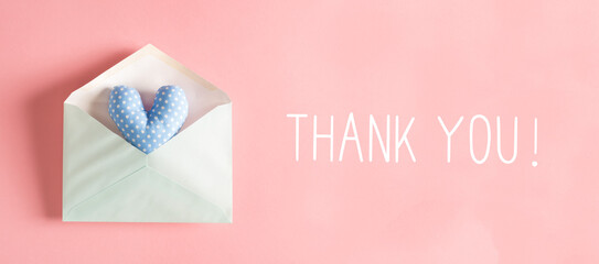Wall Mural - Thank You message with a blue heart cushion in an envelope