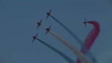 Air Display In Airshow With Jet Planes And Smoke Red, White And Blue
