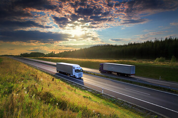 White truck transport on the road at sunset and cargo