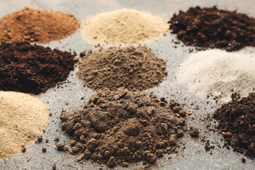 Different types of soil on grey background