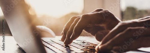 Fotografía Man hands typing on computer keyboard closeup, businessman or student using lapt
