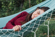 © Tasty Content  - The girl is resting on a hammock in the yard