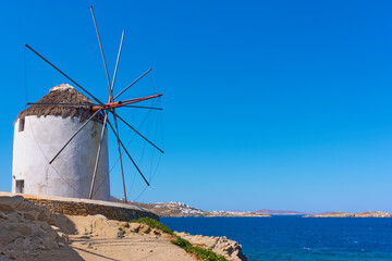 Poster - Old white windmilll by the sea in Mykonos