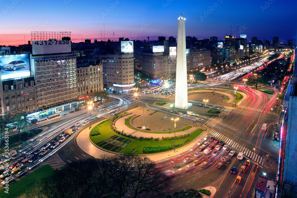 Aerial view of Buenos Aires, at Twilight, along 9 of July Avenue.  - obrazy, fototapety, plakaty 