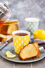 Wall Mural - Lemon cake slices and cup of hot black tea