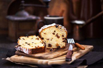 Wall Mural - Delicious homemade cottage cheese and raisins loaf cake on dark rustic wooden background