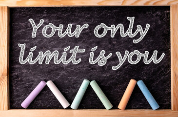 Wall Mural - Chalkboard and color chalks with text Your only limit is you. Inspirational Quotes and Business Motivational Quotes