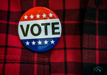 Vote Button On Red Checked Shirt
