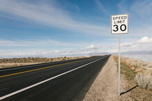 USA, Utah, Salt Lake City, Empty Road With Speed Limit Sign