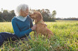 © Pauline St. Denis/Tetra Images - Woman and her dog