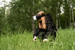 © Maxim - girl in virtual reality glasses touches the grass