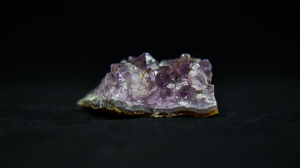 Purple crystal with a black background