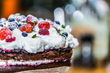 Delicious sweet cake with different fresh fruit. Sweet homemade cake. Closeup.