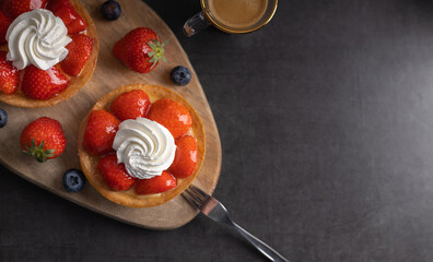 Poster - Homemade dessert strawberry pie with raspberry's and blue berry's and a coffee. Top view.