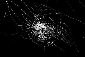 Poster - glass in cracks on a black background.