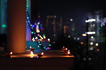 Decorated balcony with Diyas in the foreground