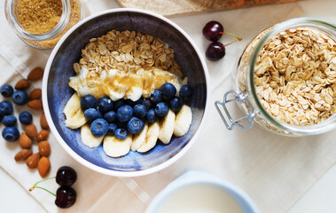 Healthy breakfast with berries, yogurt and oat flakes.