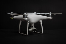 White Drone (Quadrocopter) With Camera On Gimbal On Dark Background