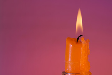 Candle with smoke and flame photographed in the studio with color foils before the flashes