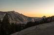 Sunset over the stone hills next to Olmsted Viewpoint in Yosemite National Park at sunset