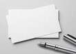 © Kuzmick - Mockup of business card with fountain pen at white paper background