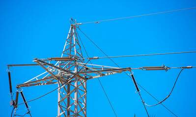 high voltage line against blue sky