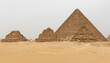 Pyramid of Menkaure along with three small pyramids at Giza