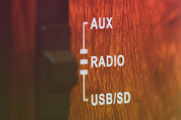 close-up of vintage music radio player aux, radio and usb button. Color filter