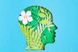 © netrun78 - Papercut head with with green leaves inside. Mental health, psychology, memory, logic, green thinking, ecology idea