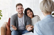 © Prostock-studio - Joyful multiracial couple hugging after psychotherapy with marital therapist indoor